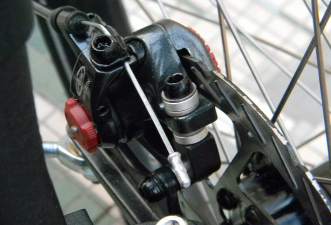  - The Avid BB7 brake calipers can be adjusted without any tools using the red dials on either side.