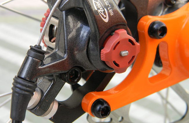  - The Avid BB7 calipers are extremely adjustable. There is a red knob on each side which adjusts the brake pads.