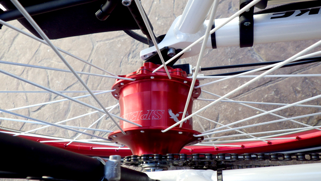  - WOW! Look at that anodized red Rohloff 14-speed hub transmission.