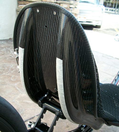 Seat - Even the seat is light weight on this trike! This hard-shell seat is make out of carbon fiber making it strong and light weight.