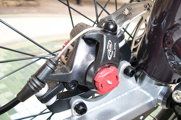  - We went with BB7 brakes all the way around. The double pull levers up front each actuate two brakes. 