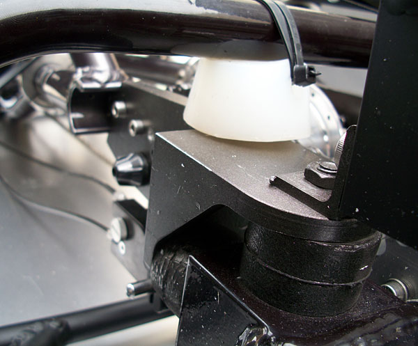 Rear Suspension - The limited suspension of the Quad conversion is designed to keep all 4 wheels on the ground while cornering. There are two elastomers per side that carry the weight of the Quad. The white elastomers on top are used as bumpers while engaging the rear brakes.