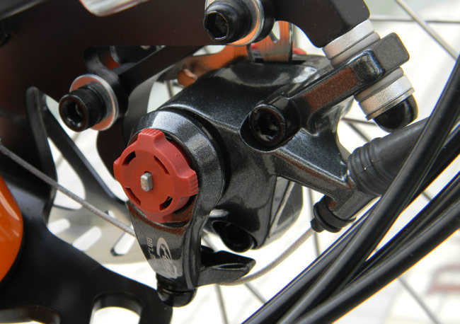  - The Avid BB7 brakes are easy to adjust using the red knobs on each side of the caliper. With their large brake pads the stopping power is terrific.