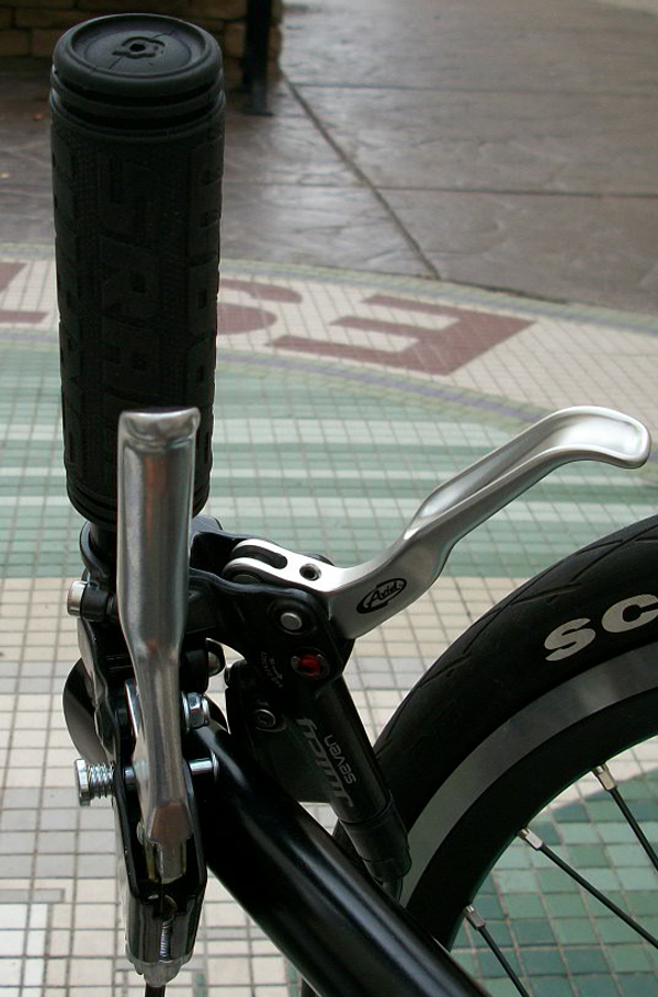 Brake Levers - On the left side I have the rear parking brake lever offset so Ican still use it as a drag brake. My main front brakes are the Avid Juicy 7s.