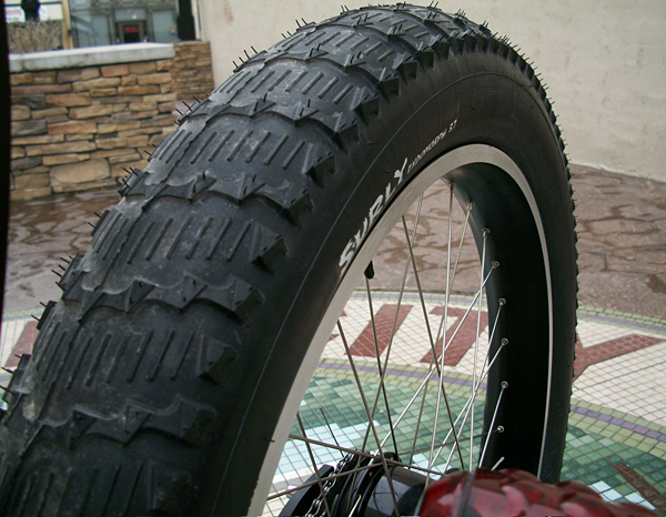 Big Tread - This was the least aggressive tread we could find in this size. Once the center ridge wears down it will be awesome on the road. As it is though, it's a very smooth ride with just a little rumble on smooth concrete.