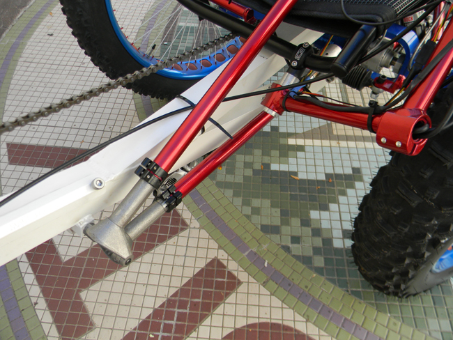 The front steering was also a challenge. The large wheels made any kind of lever actuated controls impossible to get in the right position. We initially decided on another servo for the front steering, but decided that for safety reasons (in case the battery died) we needed a manual setup. This custom geared pivot made it possible. The lower shaft connects to the rack and pinion system, while the upper shaft connects to the steering wheel and can be articulated as needed.